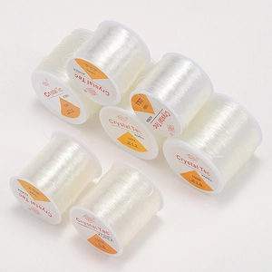 Rolls of clear elastic crystal bead cord in various sizes for DIY jewelry making