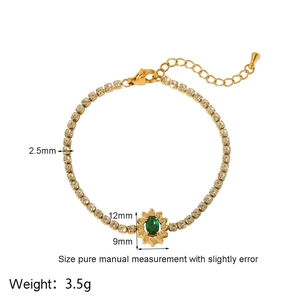 Detail of 18k gold plated tennis bracelet with green zircon centerpiece and 2.5mm width