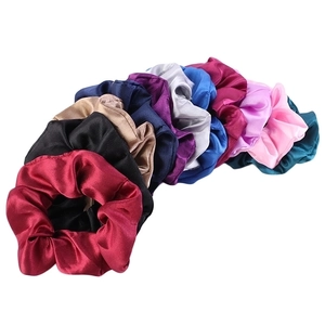 Detailed set of 10 colorful satin scrunchies featuring glossy silk-like fabric texture