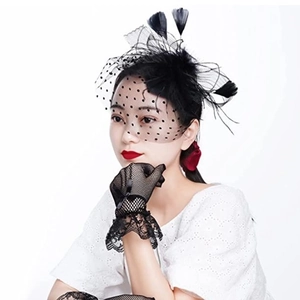 Vintage black mesh veil hat with feathers and matching lace gloves for bridal hair styling
