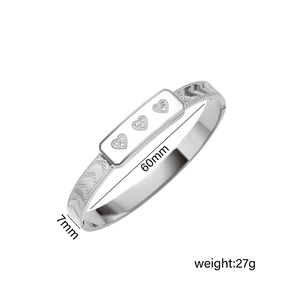 Silver stainless steel heart bangle with diamond inlays and arrow patterns, 60mm diameter