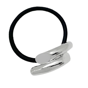 Minimalist elastic hair tie with silver metallic cylinder detail on white background
