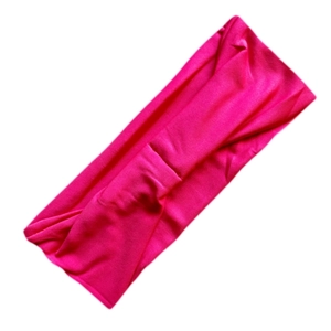 Close-up of pink elastic milk silk headband showing soft fabric texture and twist detail