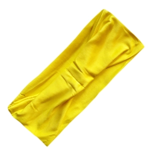 Detail shot of yellow elastic milk silk yoga headband with stylish twisted knot design