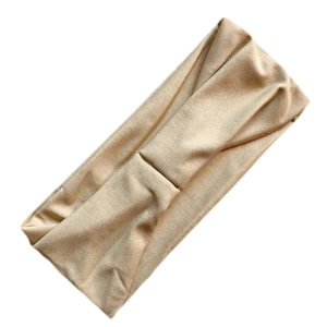 Detail showing high-elastic milk silk fabric texture of the beige yoga headband