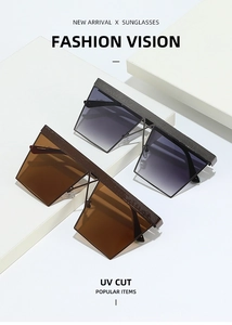 Detailed view of oversized square sunglasses with UV protection on white props