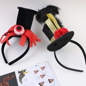 Halloween headband set featuring black top hat with eyeball and red rose with feathers