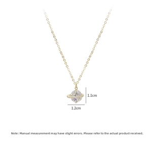 Detailed macro view showing the 1.1cm by 1.2cm sparkling zircon Saturn pendant dimensions