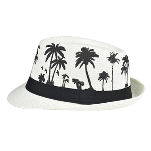 Detail of white linen sun hat featuring black palm tree prints and a grosgrain ribbon