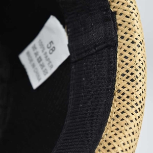 Detail of linen fedora hat inner band with 58 size label and 100% paper material tag