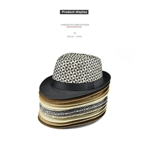 Vertical stack of assorted linen fedora hats showing varied weave patterns and colors