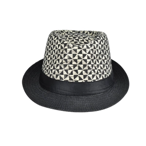 Close-up of linen fedora featuring black and white geometric woven patterns and band