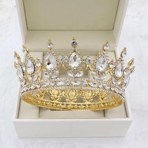 Close-up of golden Baroque bridal crown with pear-shaped rhinestones in a gift box