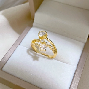 Gold adjustable open ring with heart and star charms featuring sparkling crystals