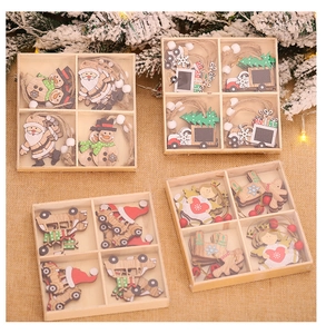 Close-up of Christmas wooden ornaments featuring Santa and reindeer in a rustic box