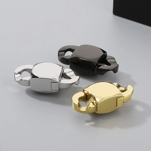 Three double-ended metal jewelry clasps in gold silver and black for necklaces