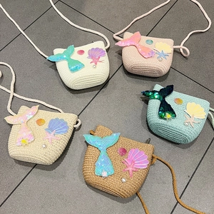 Kids straw shoulder bags featuring mermaid tails and starfish decor in five colors