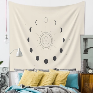 Detail of bohemian wall tapestry with black moon phase and geometric star pattern