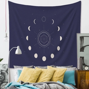 Detail of bohemian moon phase tapestry showing star map patterns on a bedroom wall