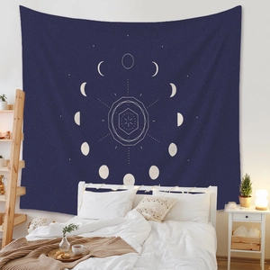 Detailed fabric texture of Bohemian moon phase tapestry in deep blue and white hues
