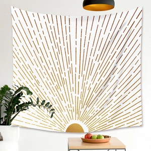 Detail of bohemian sunburst wall tapestry with modern gold lines in a minimalist interior
