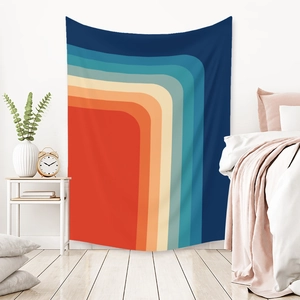 Detail of bohemian rainbow tapestry with retro geometric lines on bedroom wall