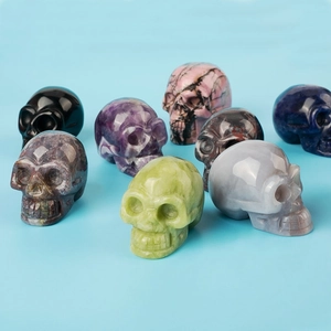 Handcrafted natural crystal skull figurines set in diverse colors for holistic decor