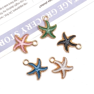 Macro shot of five colorful enamel starfish charms with gold alloy base for DIY jewelry making