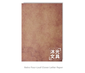Macro view of vintage kraft writing paper with aged textures and distressed clover motif