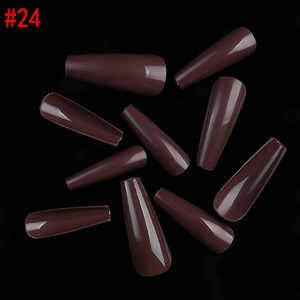 Macro detail of glossy dark brown coffin press on nails showing size numbering #24