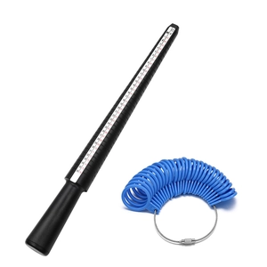 Close-up of black plastic ring sizer mandrel and blue sizing gauges for jewelry