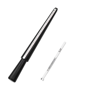 Close-up of black ring sizer mandrel and white finger gauge tool with sharp UK US scales