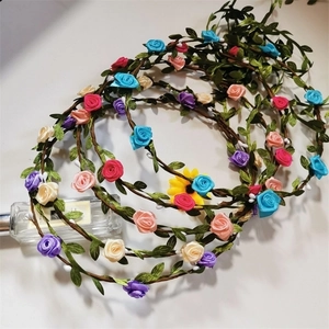 Floral wreath headbands with colorful fabric roses and green leaves for beach weddings
