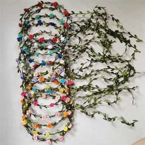Handmade flower crowns with colorful roses and green leaves for beach travel and weddings