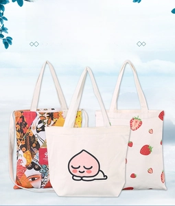 Detailed close-up of thick canvas bags with strawberry and peach prints on blue background