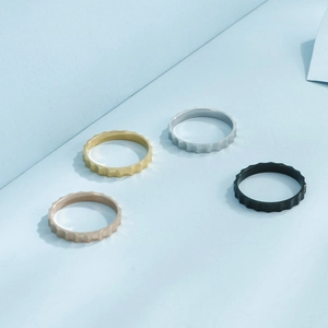 Minimalist irregular wavy gear rings in gold, silver, rose gold, and black steel finishes