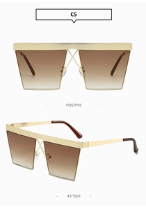 Close-up of square metal sunglasses with X-shaped bridge and textured top bar details