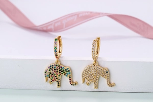 Detail of gold elephant earrings with vibrant rainbow zircons and clear crystals