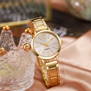 Elegant gold quartz watch for women with small white dial and classic link bracelet
