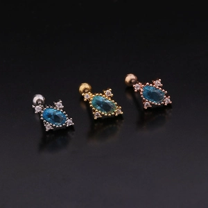 Detailed view of colorful zircon cartilage studs in silver, gold, and rose gold finishes
