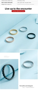 Close-up of wavy gear-edge titanium steel rings in gold, silver, rose gold, and black
