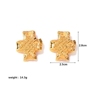 Detail view of gold cross earrings with textured finish and measurement specifications