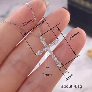 Luxe silver cross pendant with sparkling white cubic zirconia and precise measurements