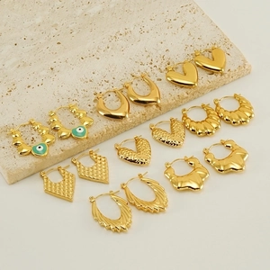 Collection of 18K gold plated earrings featuring green evil eye and heart charms