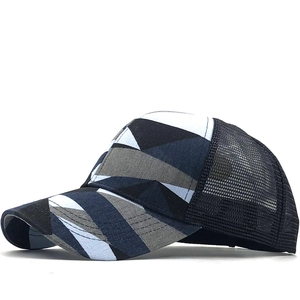 Navy blue and grey geometric pattern trucker hat with black breathable mesh back