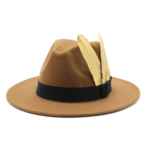 Detailed view of a brown wool fedora with a black band and gold feather accents