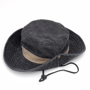 Washed outdoor boonie hat in black canvas with khaki trim and adjustable chin strap