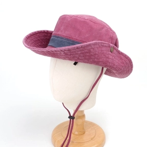 Detail view of pink washed cotton sun hat with adjustable windproof drawstring and metal buttons