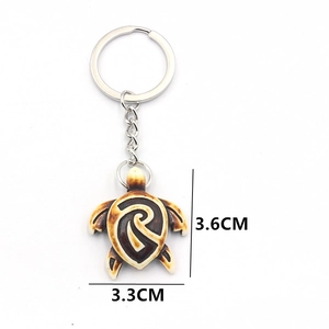 Artistic sea turtle keychain made of alloy and resin with spiral carved patterns
