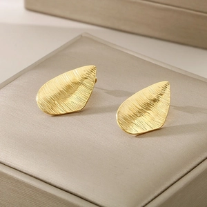Minimalist gold teardrop stainless steel studs with textured brushed metal finish